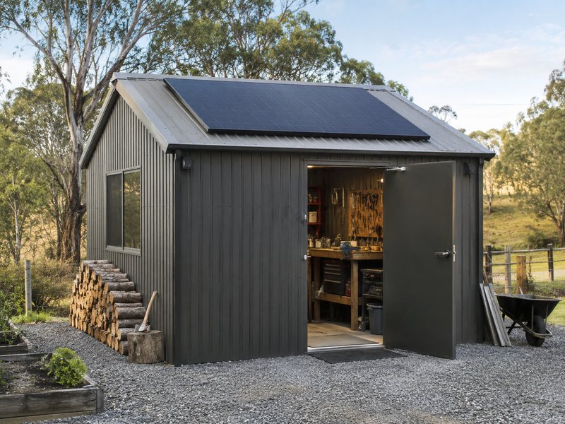 Large solar panel on workshop shed roof